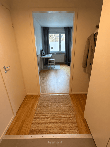 Minimalistisk entréhall med beige detaljer.png
