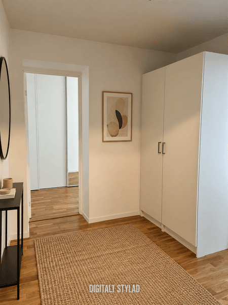 Minimalist hall med varm träkänsla.png